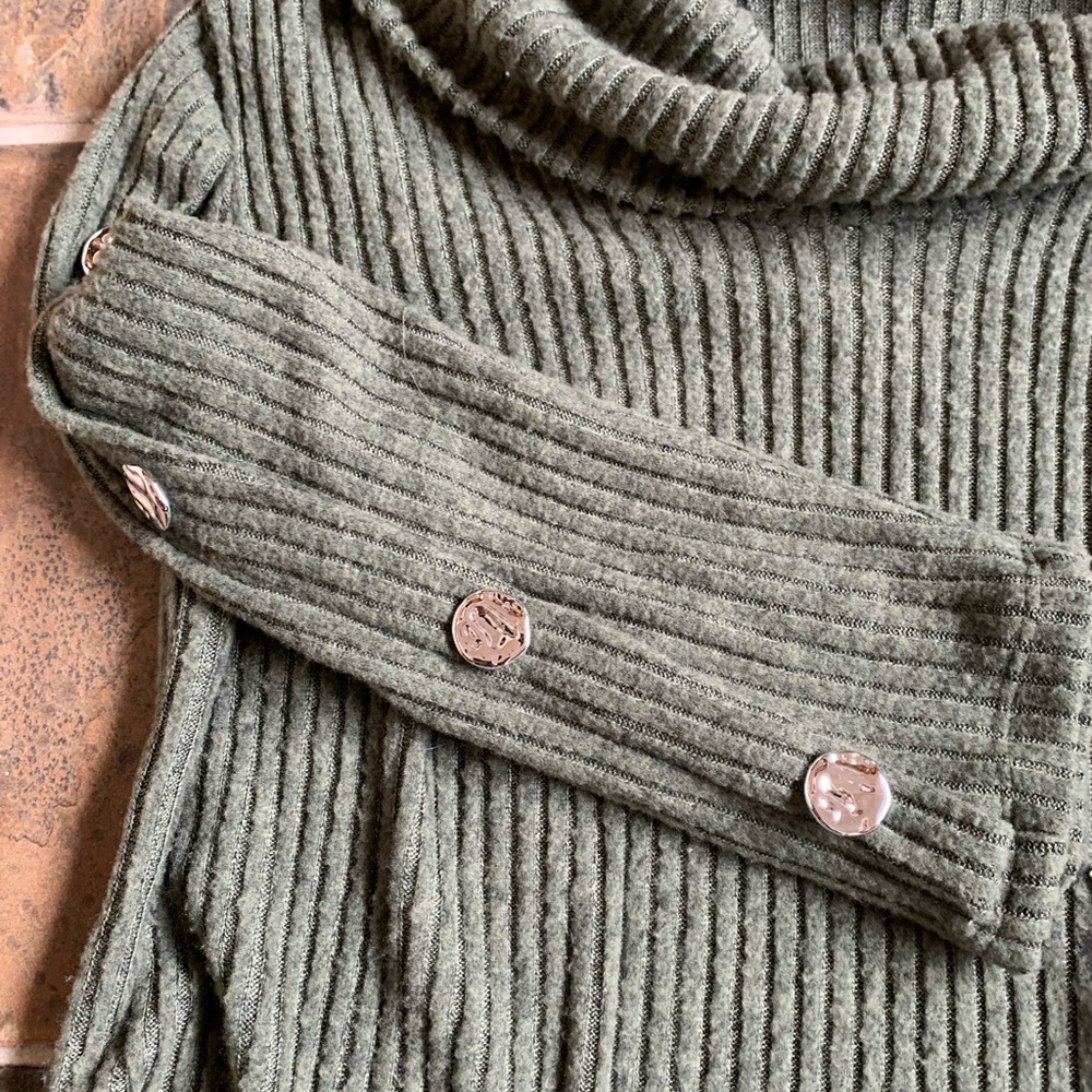 Green women’s cow neck soft sweater with button detail on sleeves